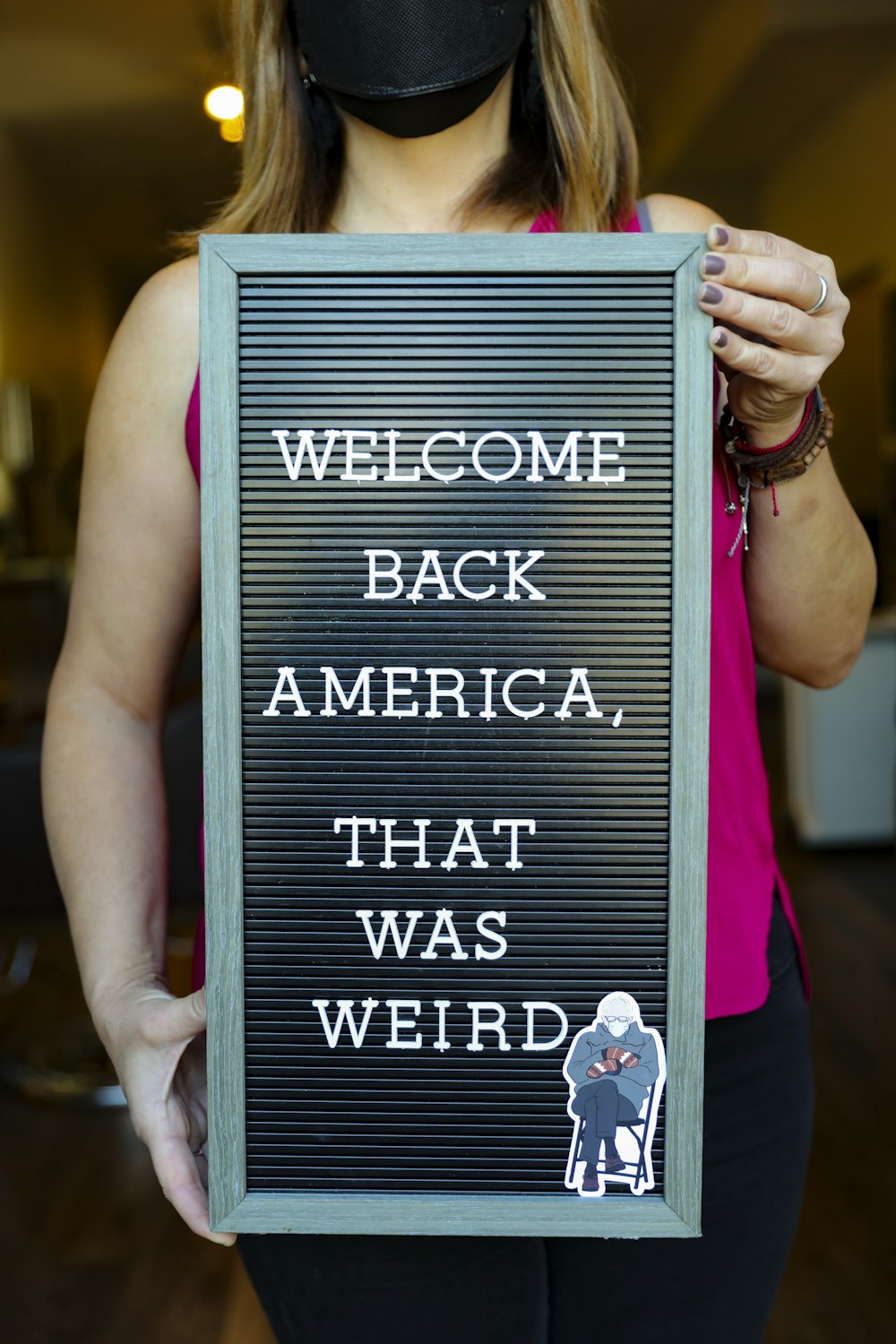 person holding black and white quote board