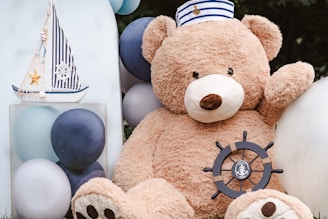 Brown plush bear with blue and white balloons, symbolizing men's weight struggles with gentle suppor