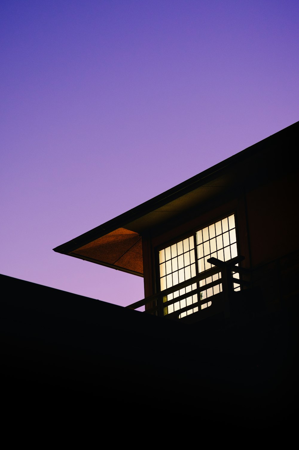 brown wooden framed glass window