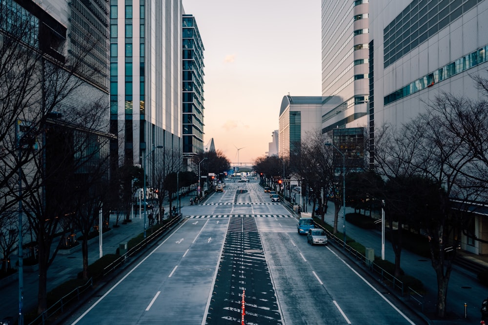 black asphalt road between high rise buildings during daytime