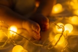 persons hand on yellow light