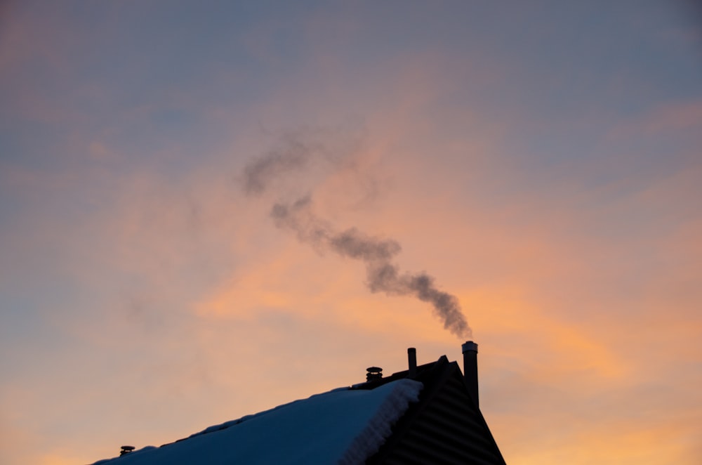 black roof under white clouds