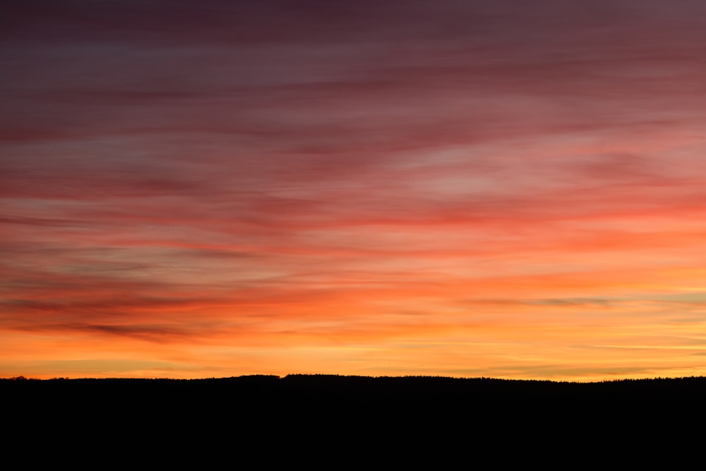 silhouette of mountain during sunset