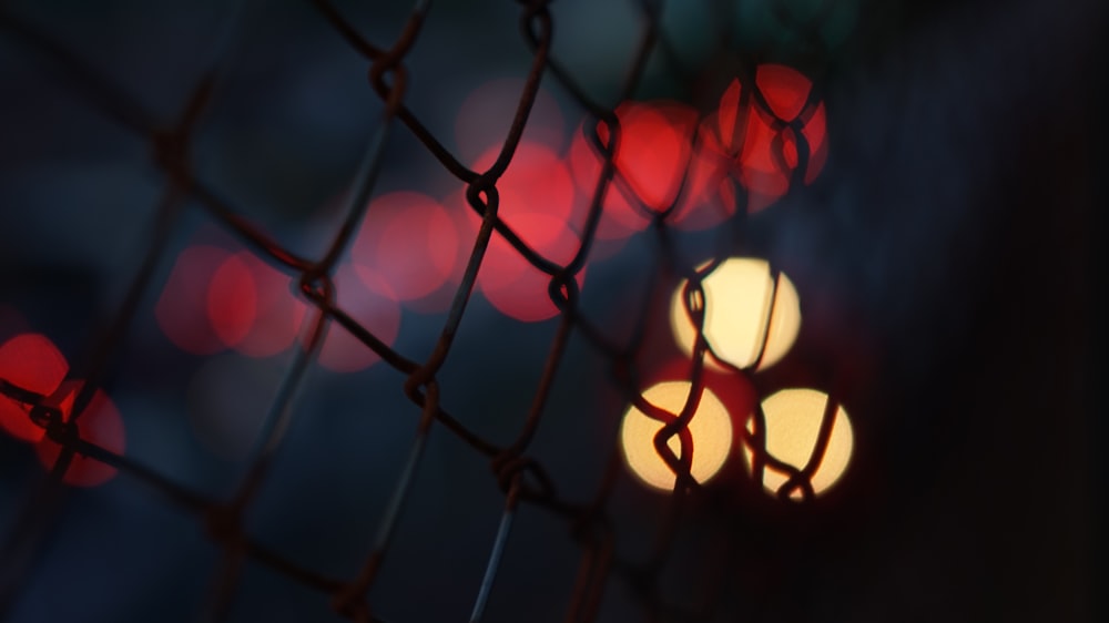 black metal fence with red light