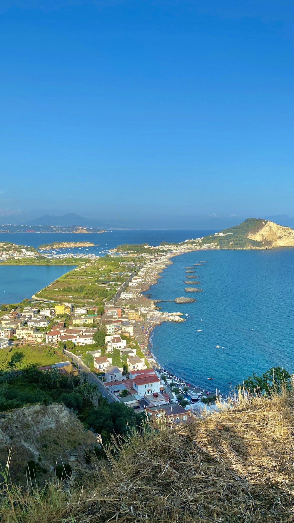 aerial view of city near body of water during daytime