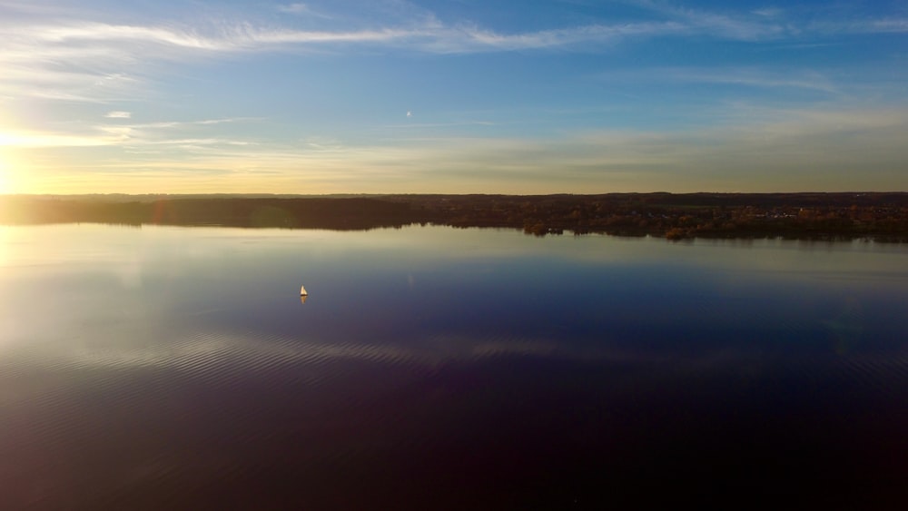 body of water under blue sky during daytime