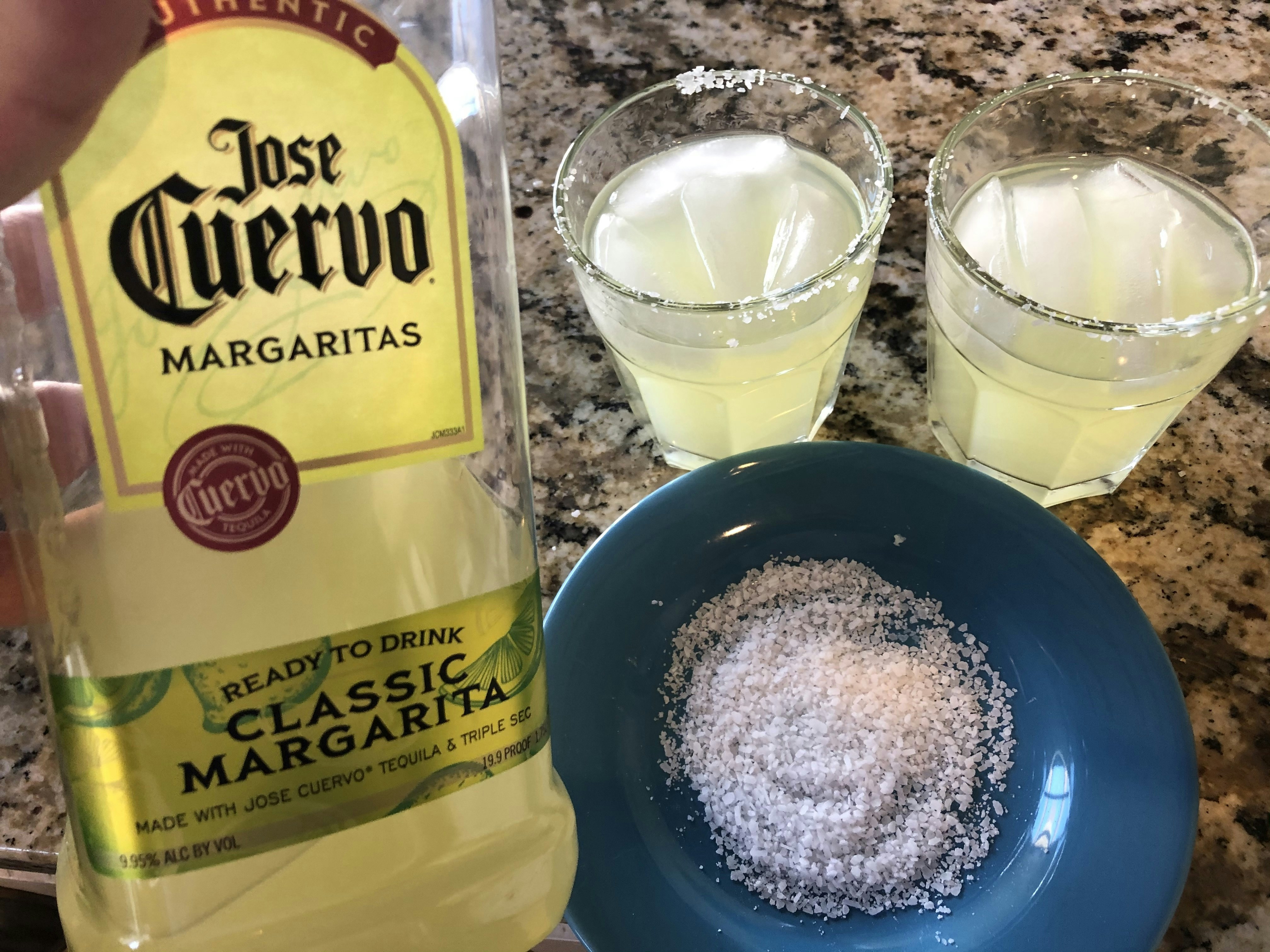 Classic Margarita cocktail in a salt-rimmed glass with lime wedge