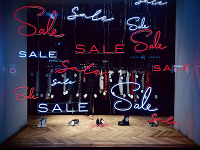 A vibrant display of colorful sale tags hanging from various products.