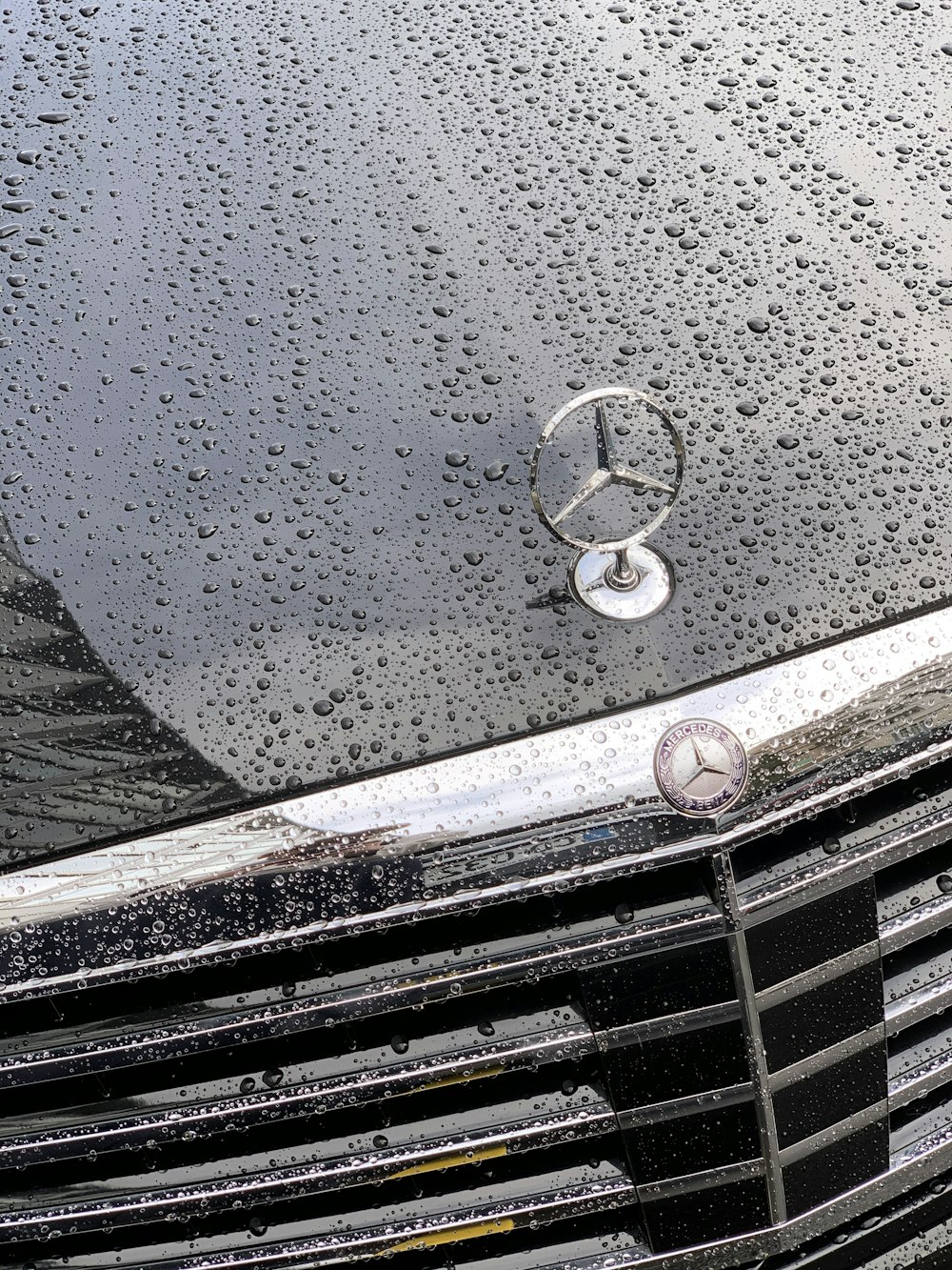 water droplets on silver car