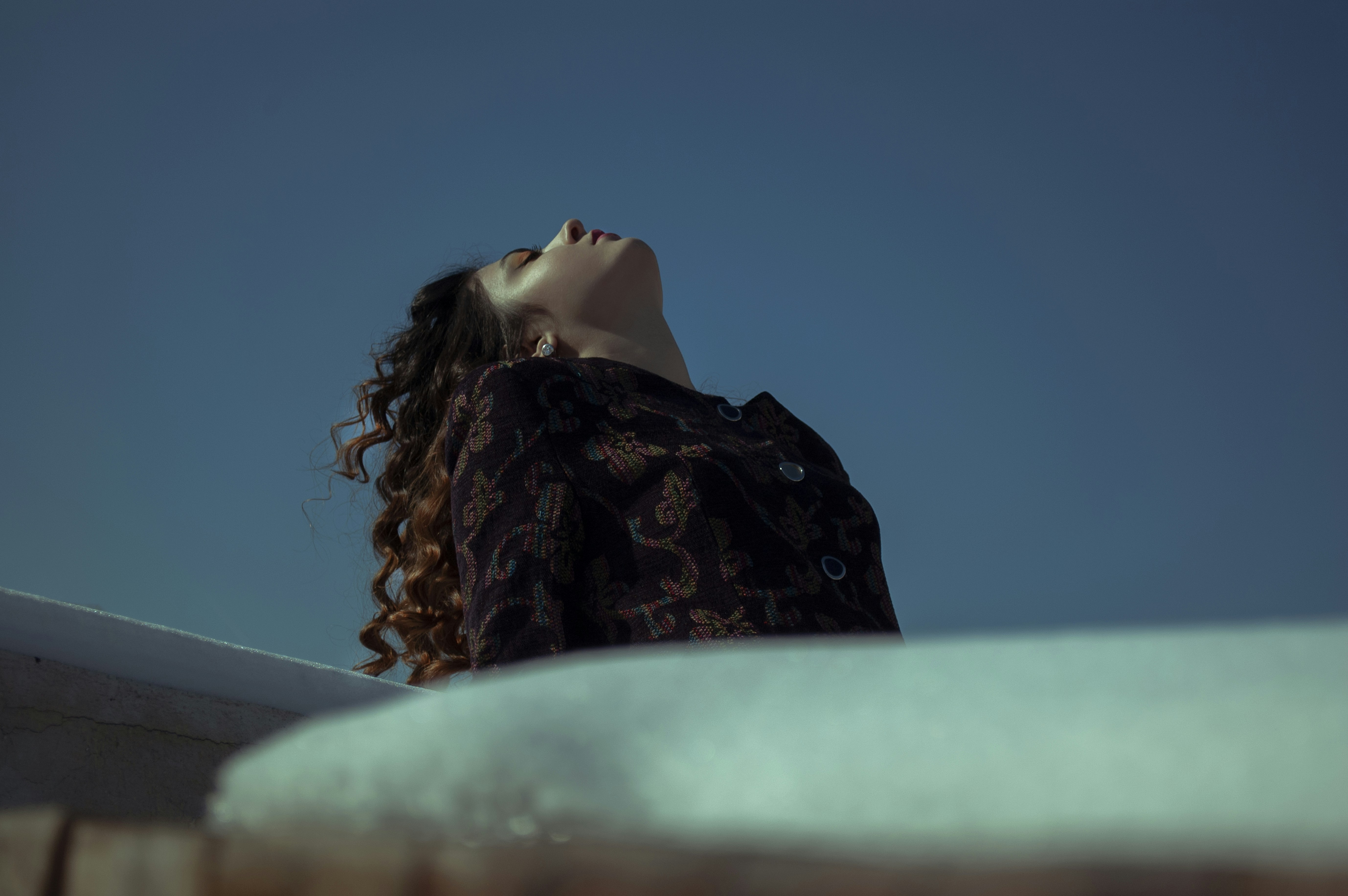 woman in black and brown floral hijab