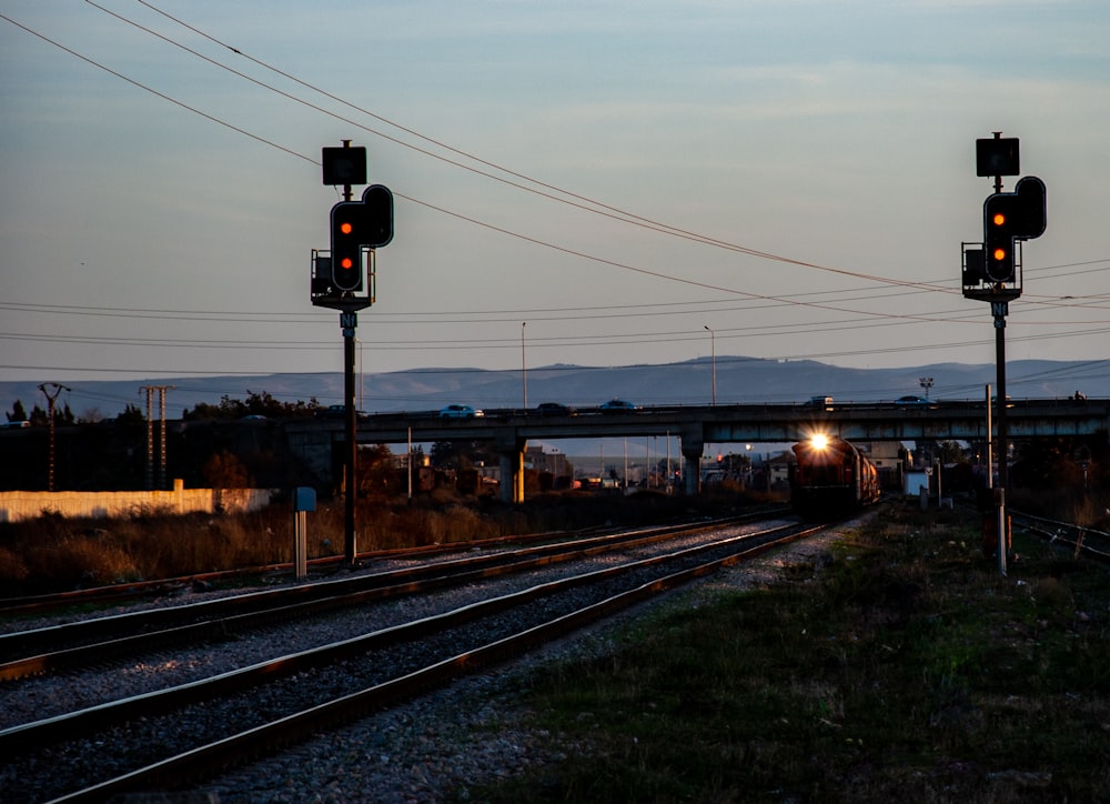 black and red traffic light on brown steel rail during daytime