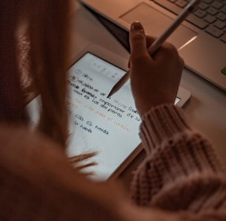 person writing on white paper