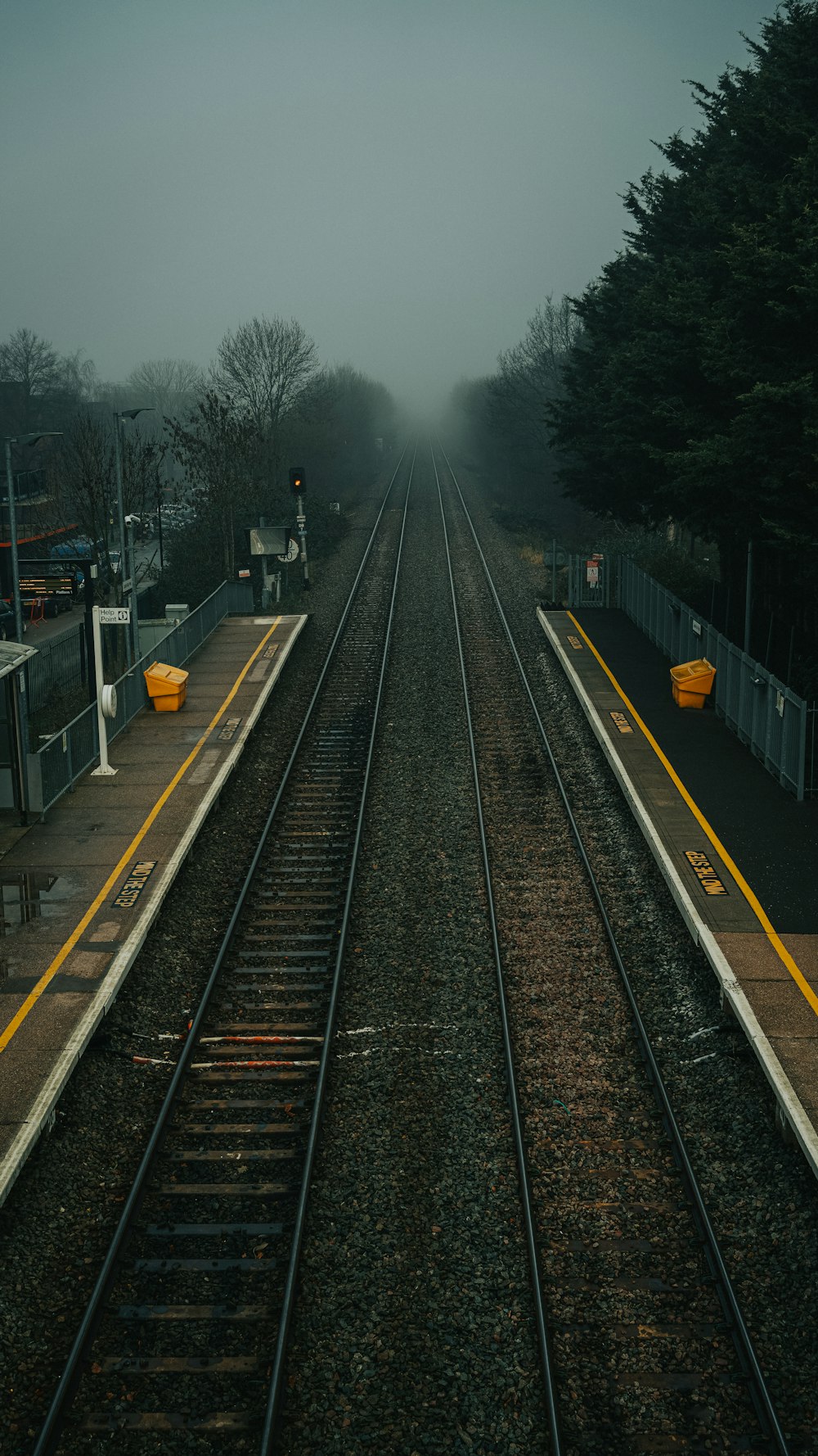 train rail tracks during foggy day
