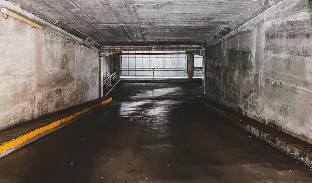 gray concrete tunnel with white wooden window