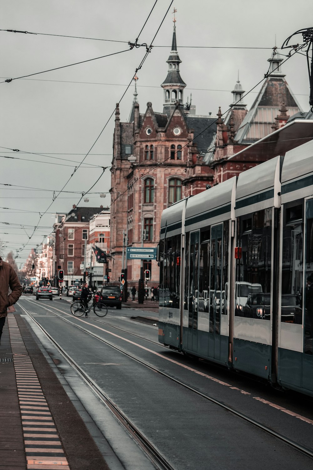 red and white tram on road during daytime