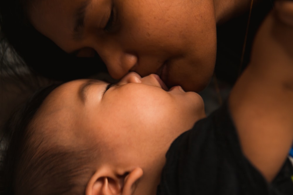 man kissing womans cheek