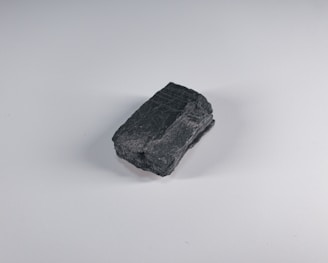 black stone on white surface