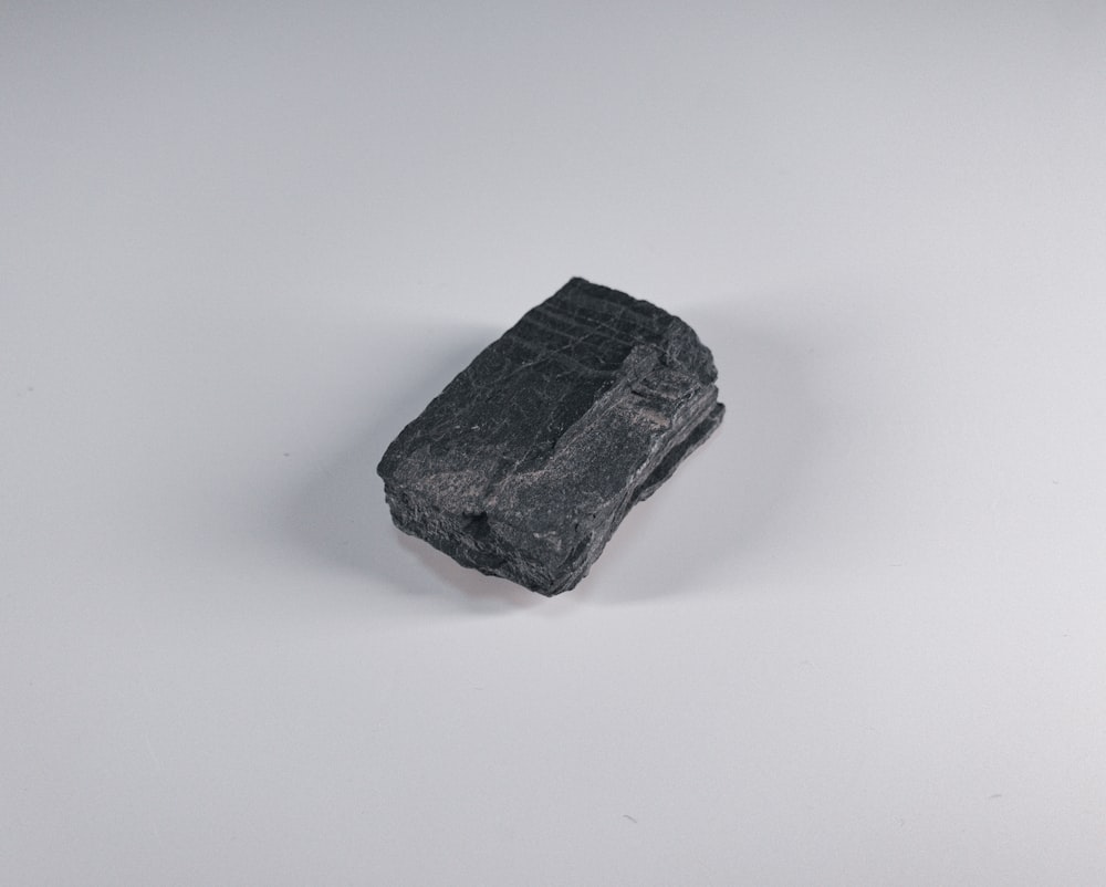 black stone on white surface