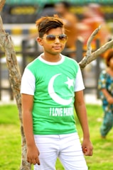 Group of enthusiastic youth wearing Karachi Green Scenes t-shirts during a plantation drive.