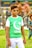 A young person wearing sunglasses and a green shirt featuring a crescent and star symbol paired with the words 'I Love Pakistan.' They are standing outdoors next to a tree, with a blurred background hinting at other people and greenery.