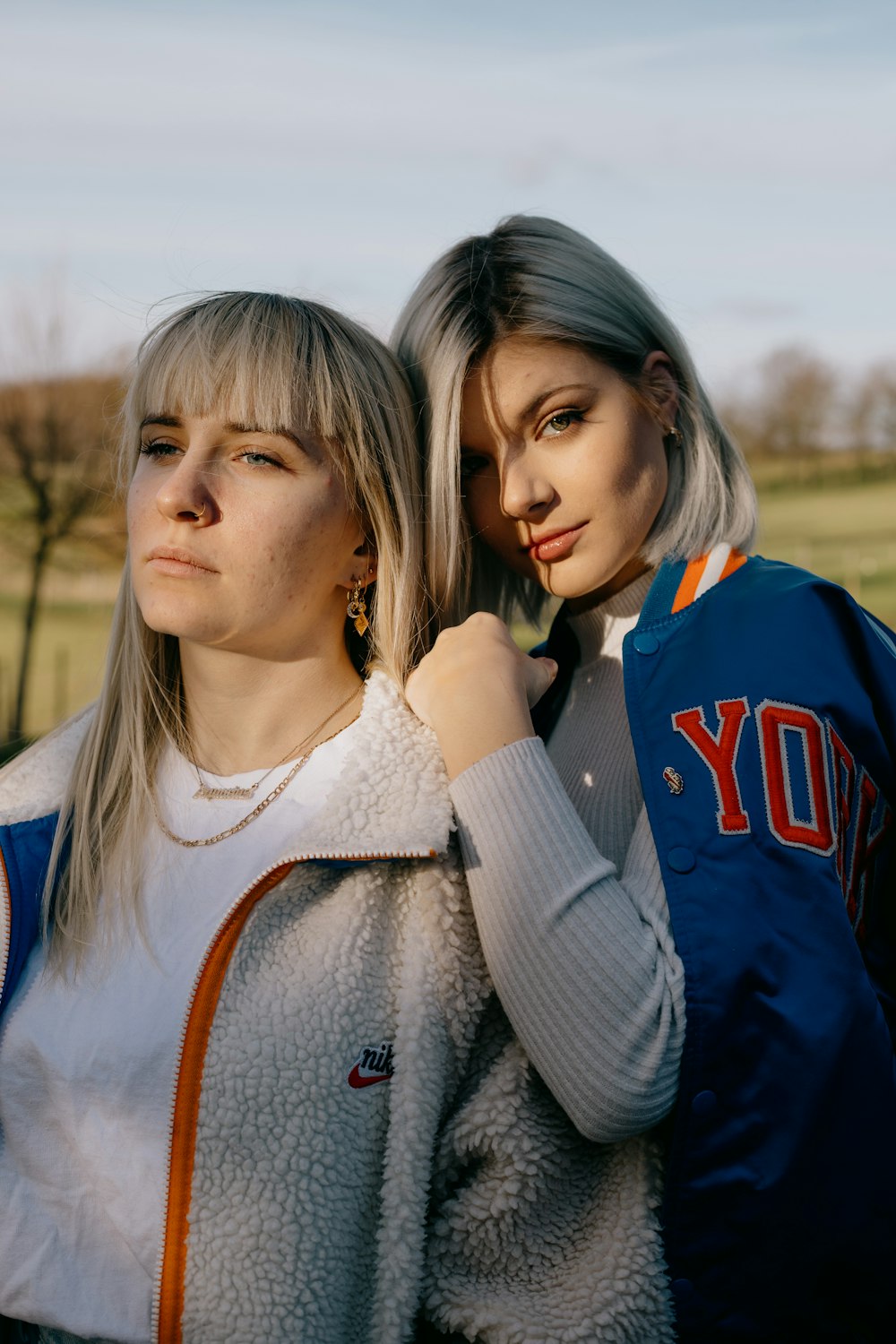 2 women smiling during daytime