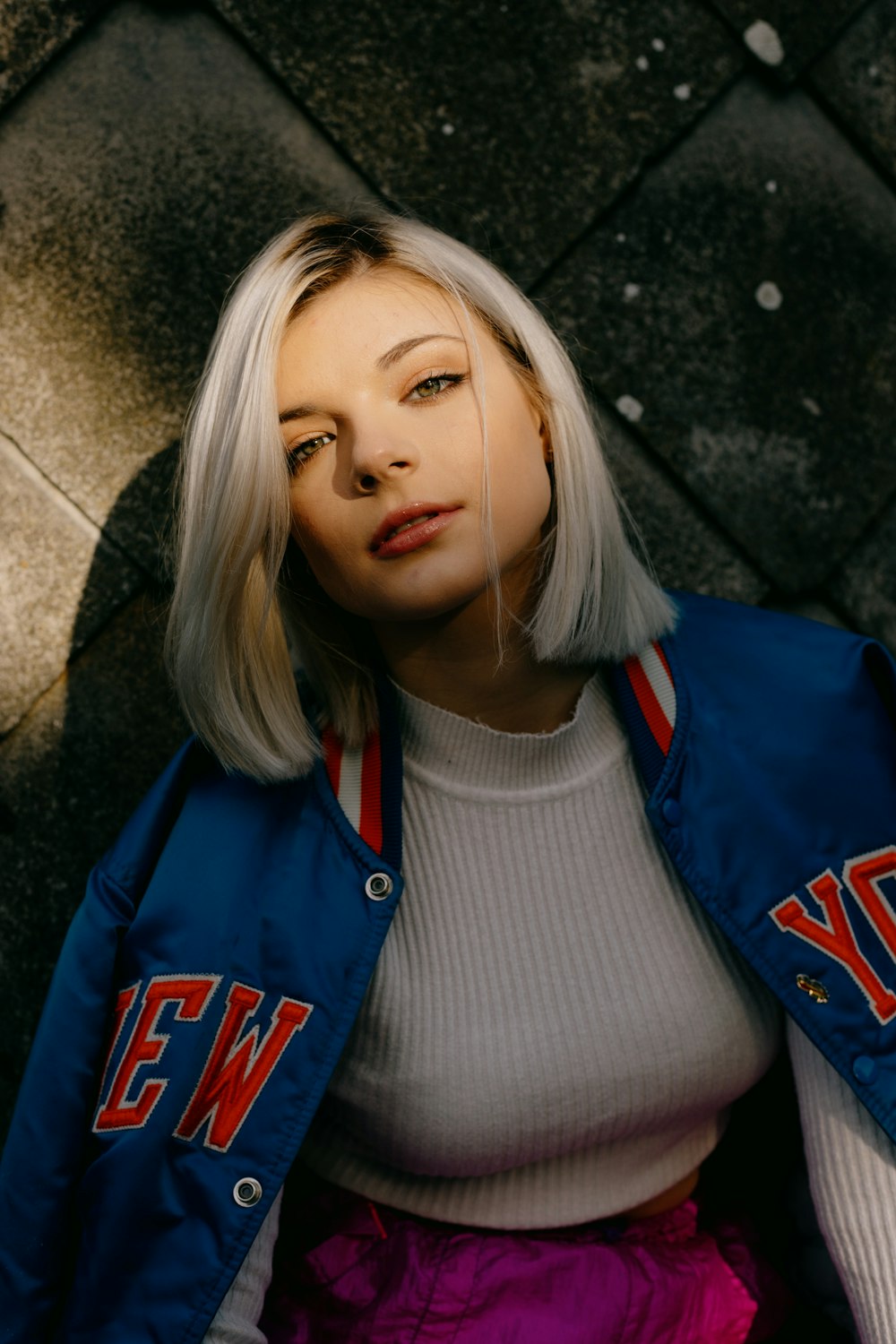 girl in white crew neck shirt and blue jacket