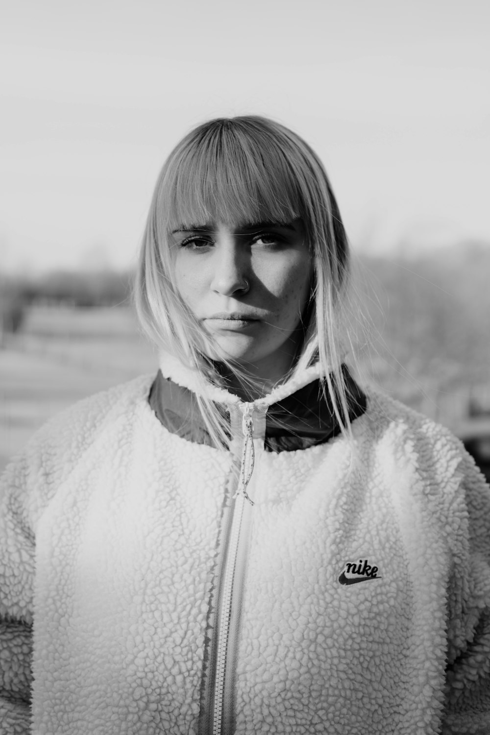 woman in white zip up jacket