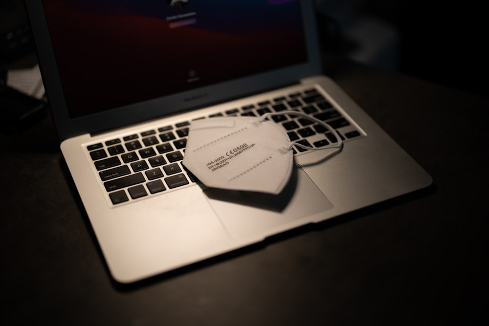 macbook pro on black table