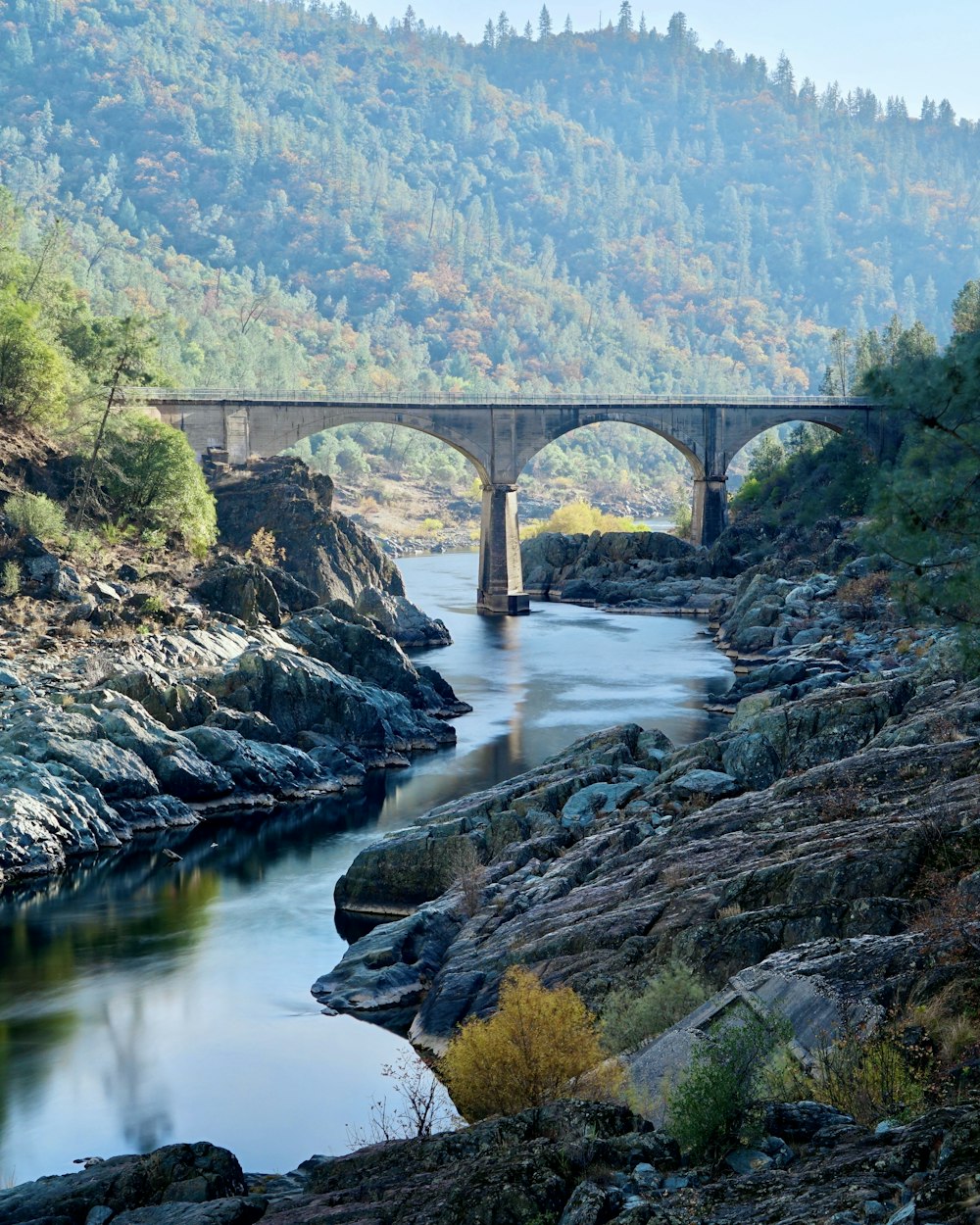 gray concrete bridge over river