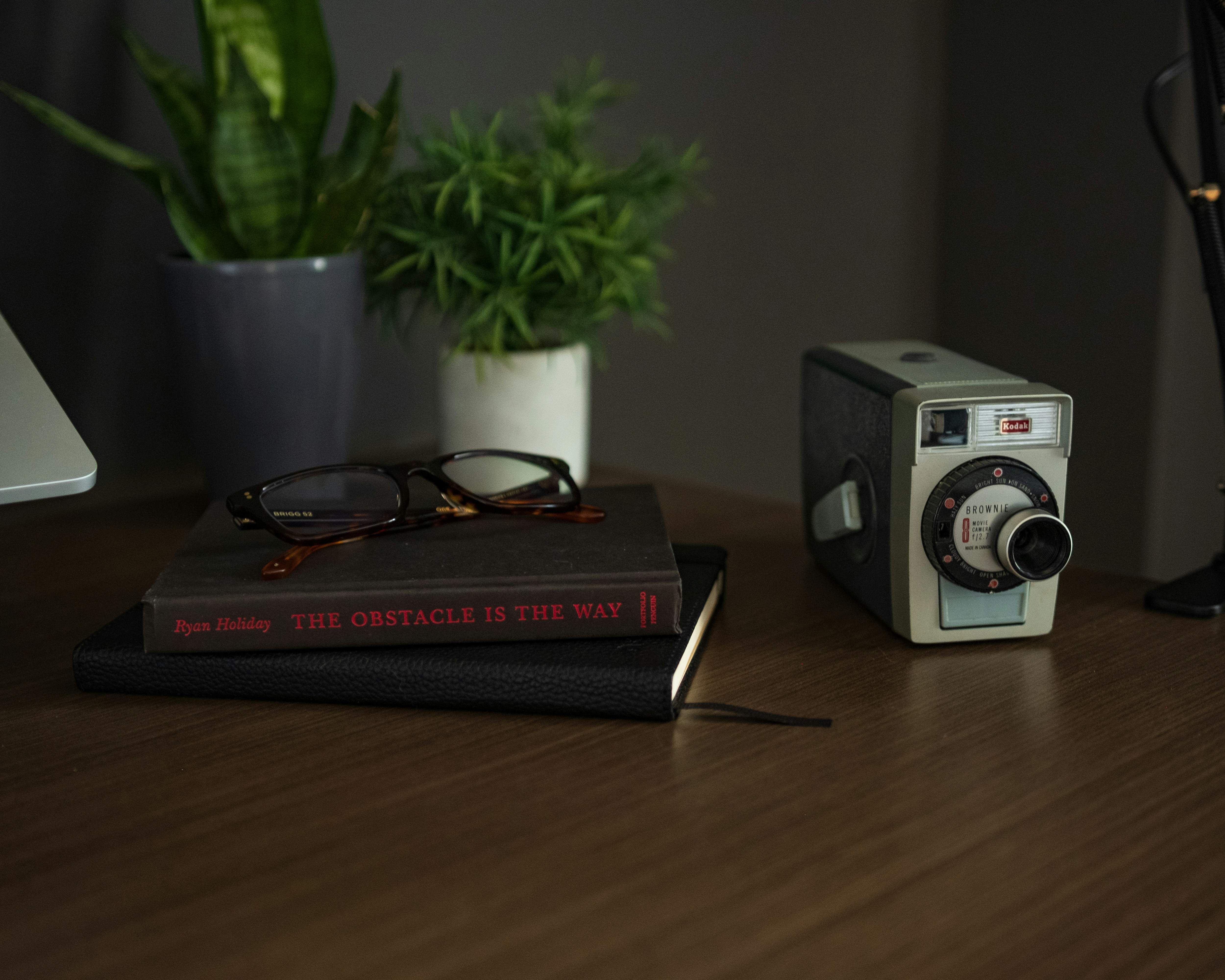 black and red camera on brown wooden table