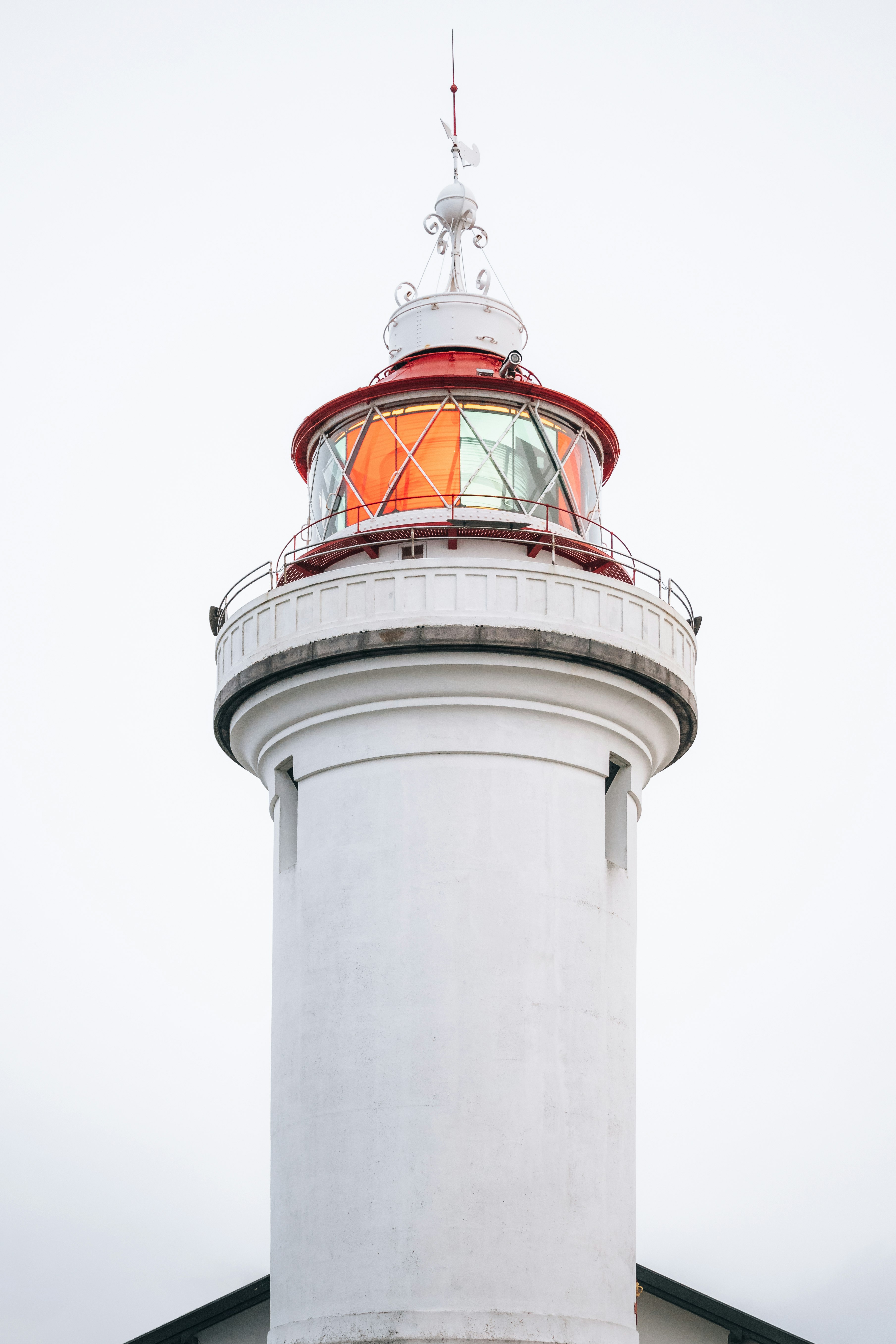 white and red concrete lighthouse