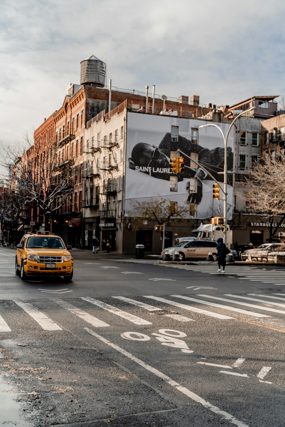 yellow car on road near building during daytime