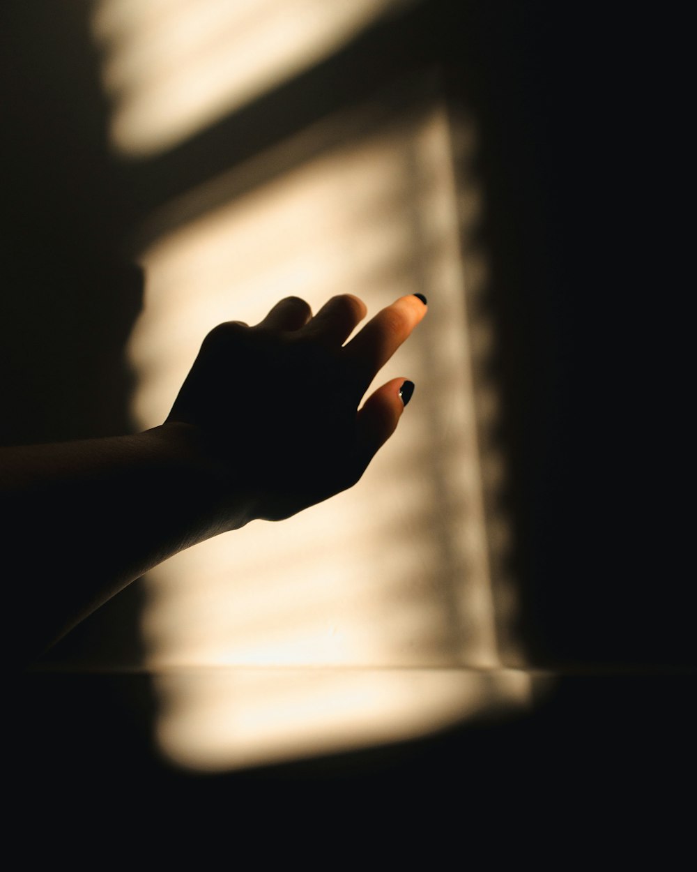 persons hand on window