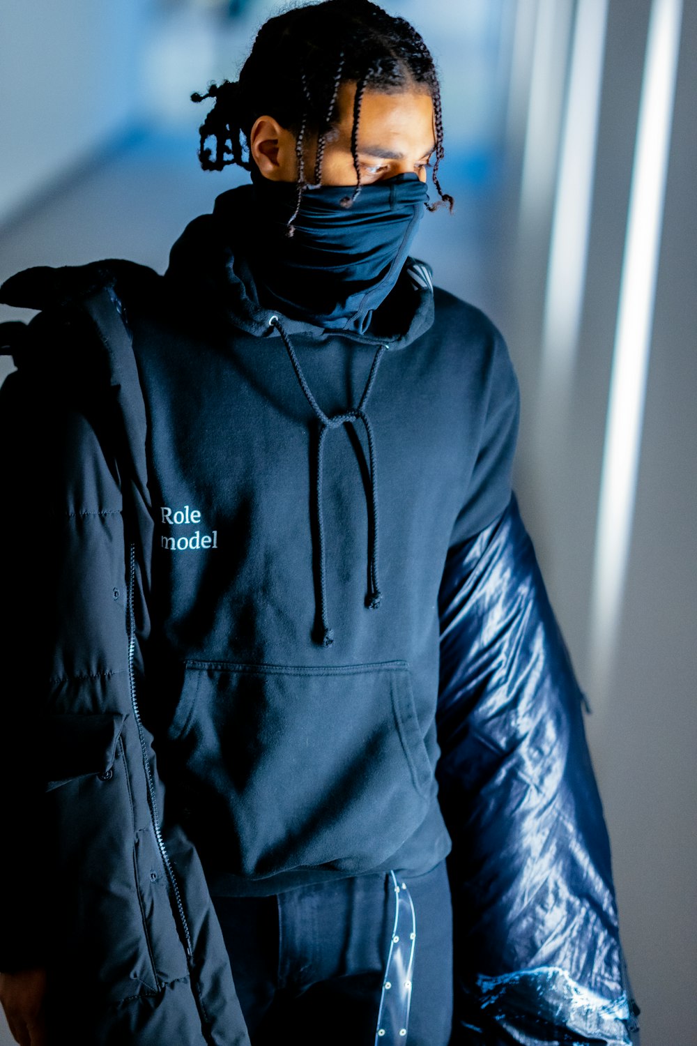 man in black adidas hoodie