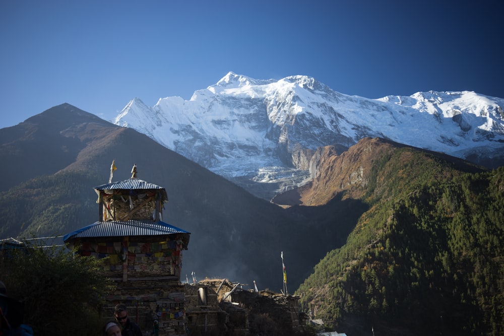 white and brown concrete building on top of mountain during daytime