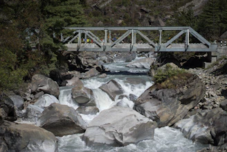 gray metal bridge over river
