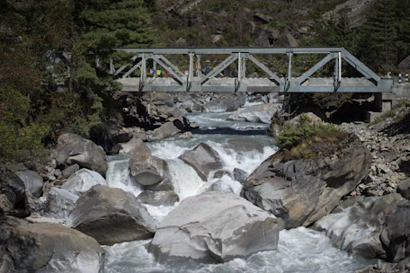 gray metal bridge over river