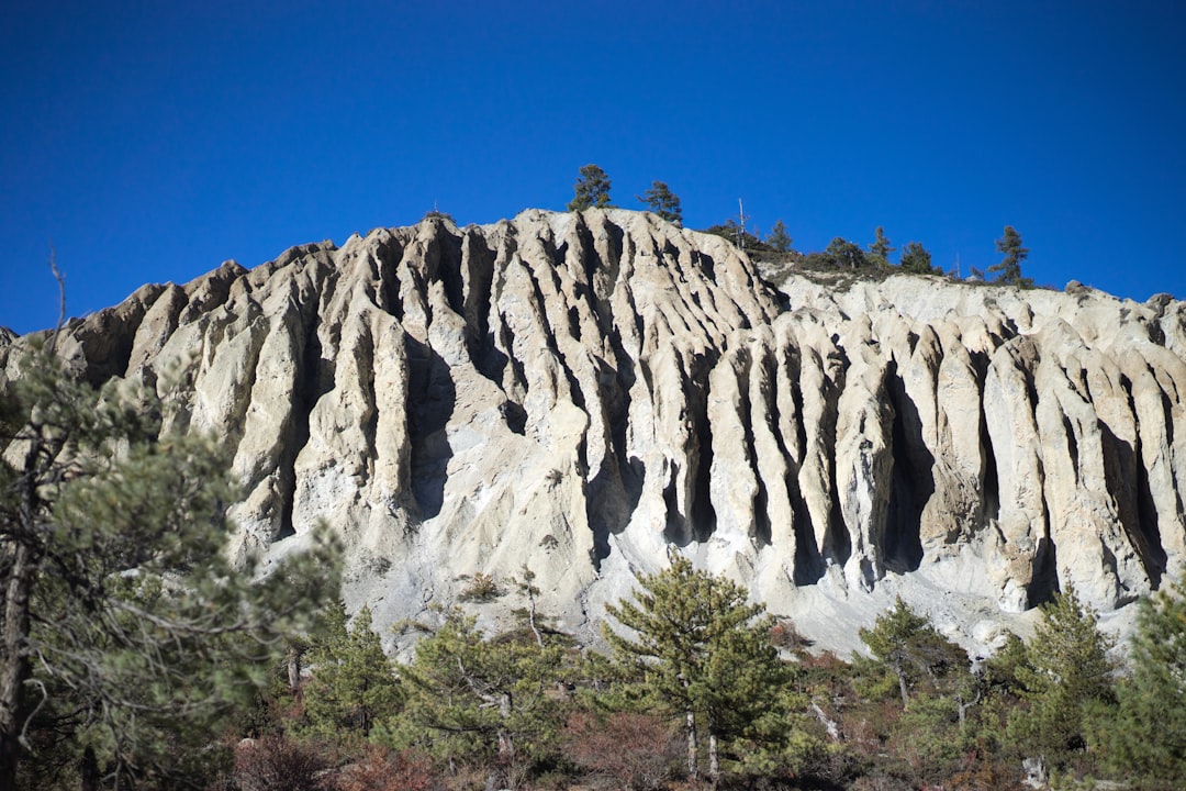 brown rocky mountain under blue sky during daytime