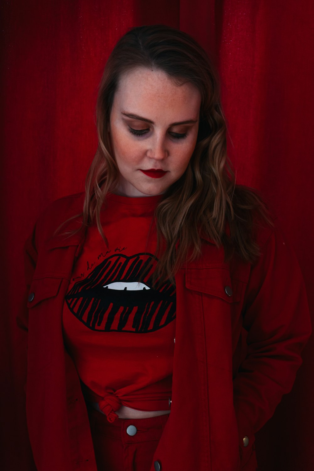 woman in red adidas jacket