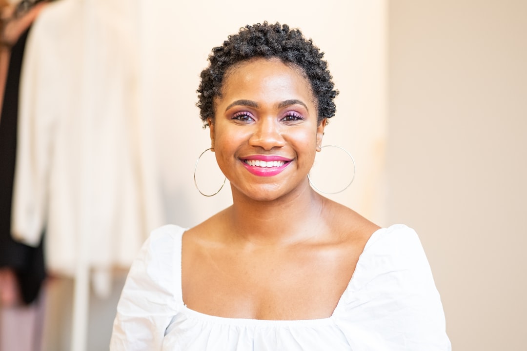 woman in white scoop neck shirt smiling, Home Studio Headshot