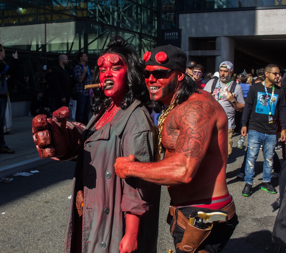 man in grey button up shirt with red face paint