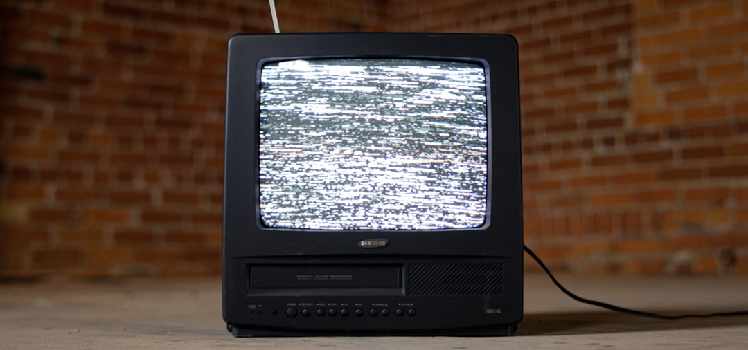  black crt tv on brown wooden table television