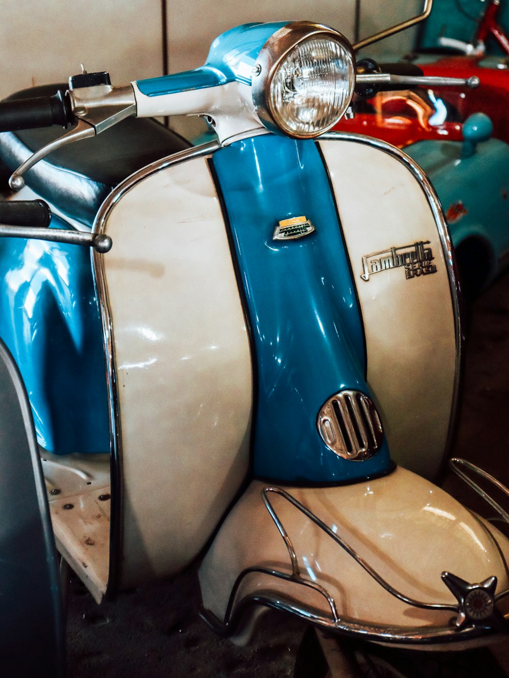 blue and white motorcycle on parking lot