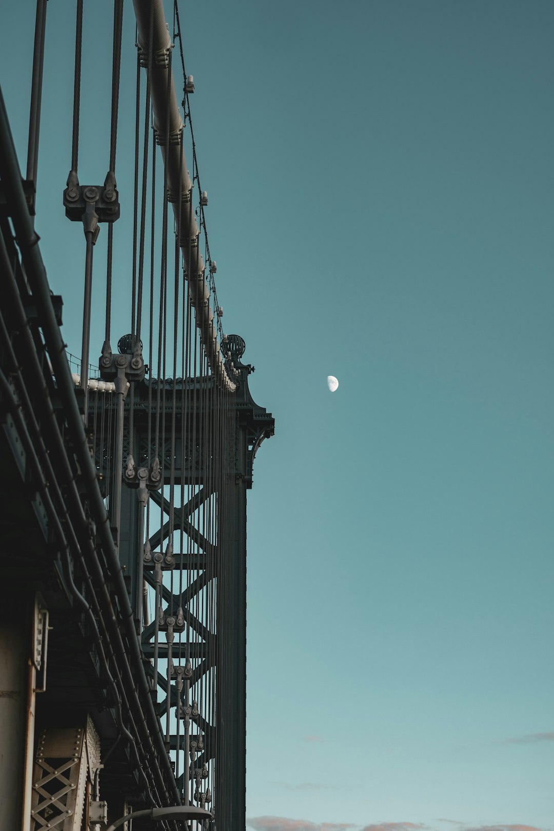 low angle photography of bridge under blue sky during daytime