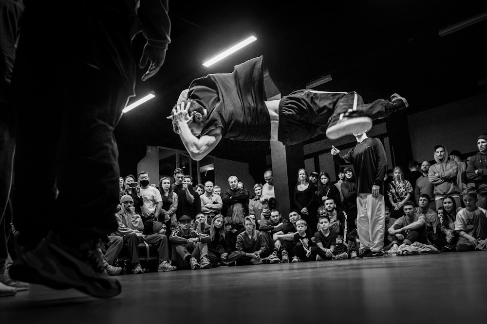 grayscale photo of people in a room