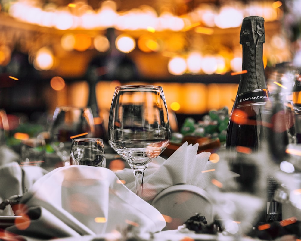 wine bottle and wine glass on table