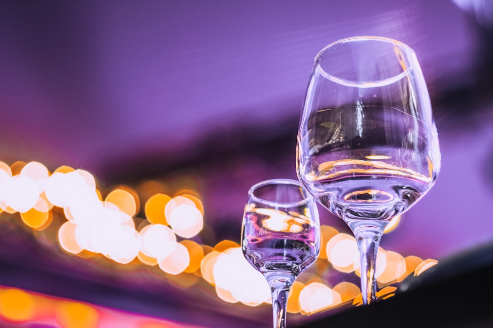 clear wine glass on brown wooden table