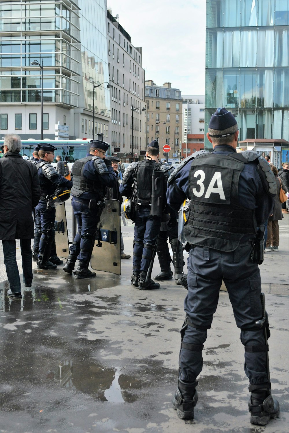 police men walking on street during daytime