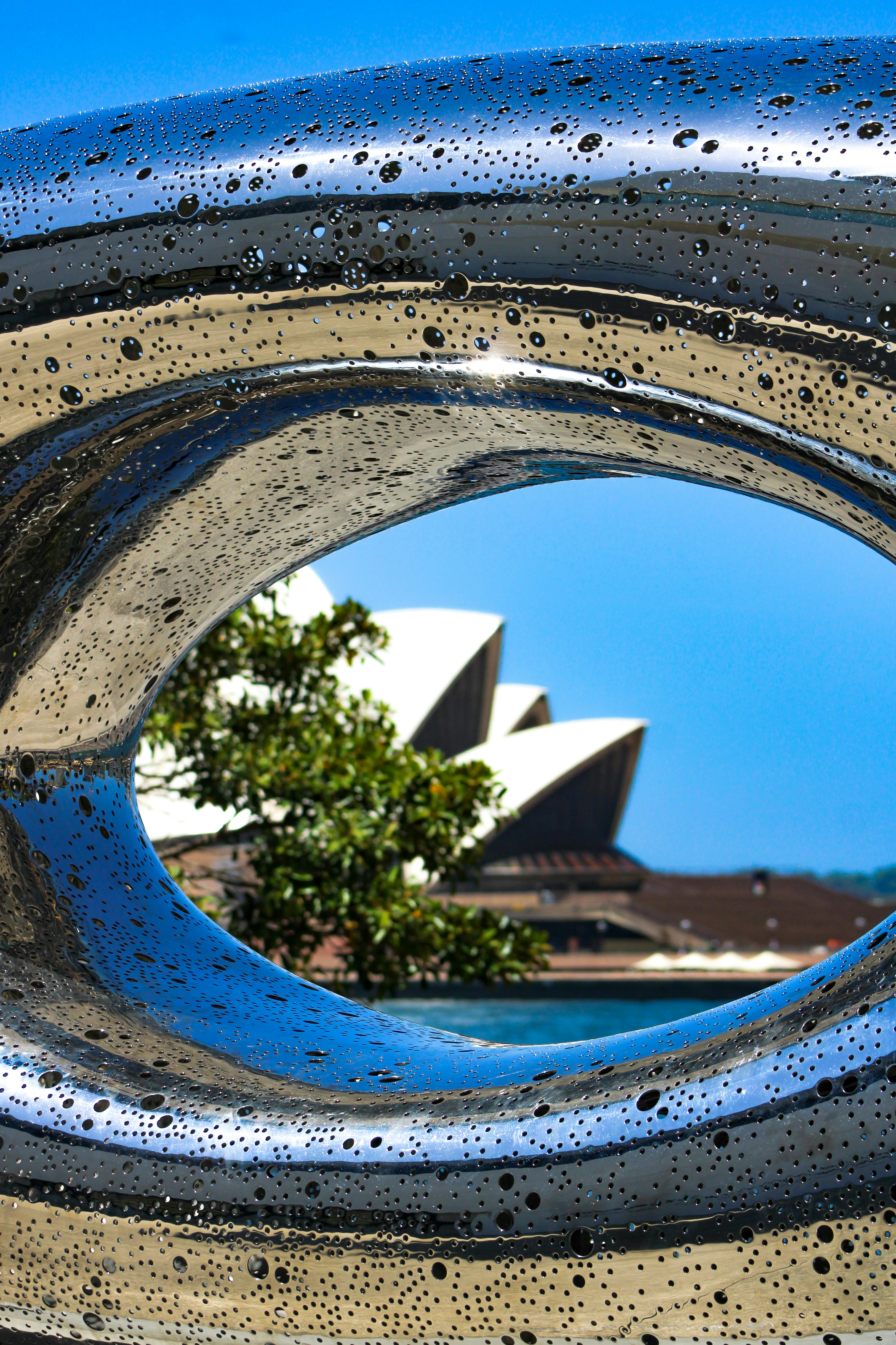 blue swimming pool near white concrete building during daytime