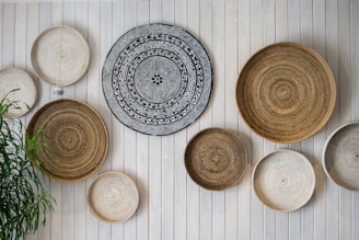 Handwoven indigenous basket displayed in a natural forest setting.
